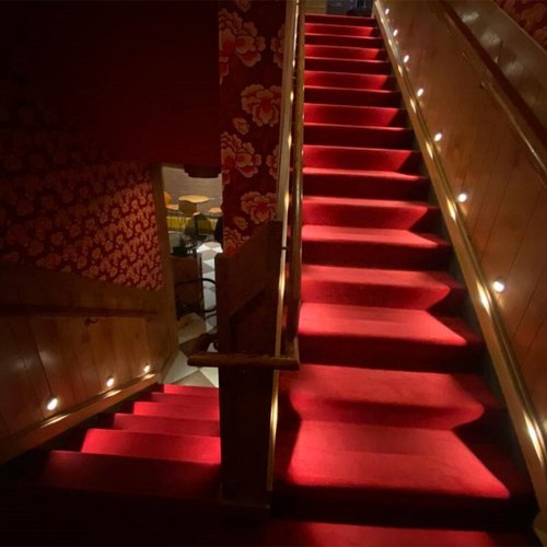 Beautiful red stair carpet installation for Blind Barber Bar by Philadelphia Flooring Solutions in Yorktown, PA